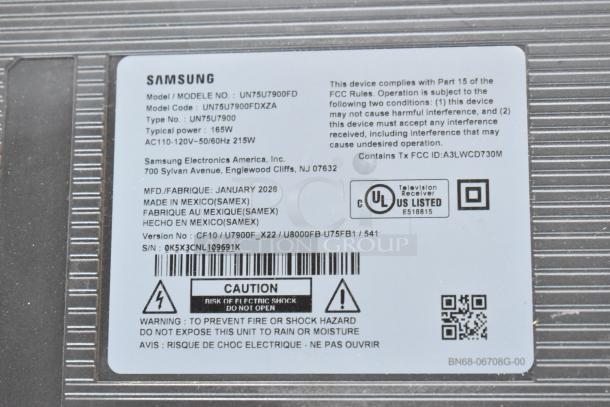 Label on Samsung TV model UN75U7900FD with product details, manufacturing date, and caution warnings.