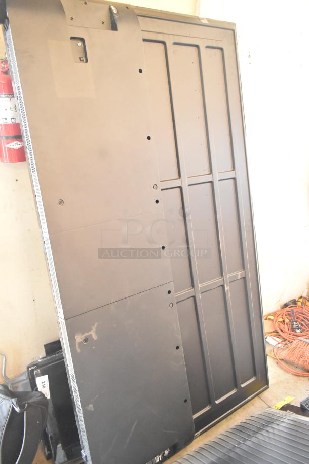 Four televisions for auction, including Samsung QN77S90FDF 77", Samsung UN75U7900FD 75", and a Vizio model. Buyer pickup only.