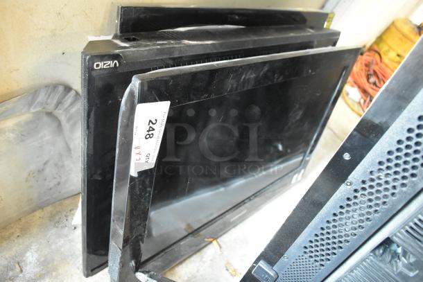 Three televisions including Samsung LN26B360C5D 26", Vizio D32h-C0 32", Onn 32S2V1 32", with visible auction tags. Buyer pick-up required.