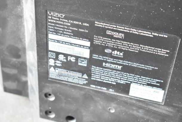 Back label of Vizio D32h-C0 32" TV showing model details, serial number, Dolby and DTS logos, HDMI, regulatory markings.