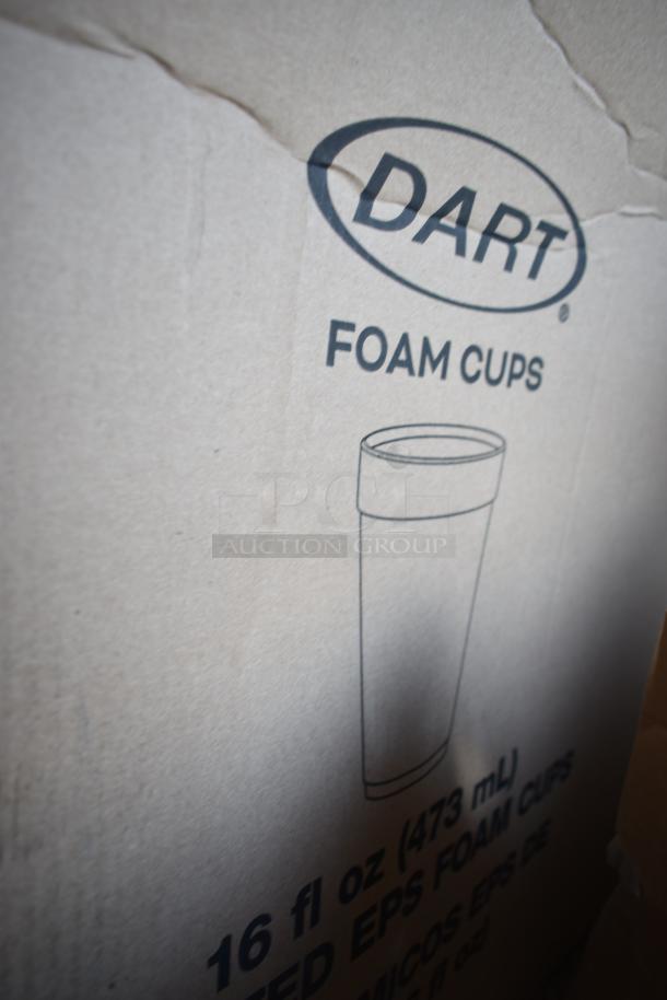 Box labeled "Dart Foam Cups," 16 fl oz (473 mL), on cardboard, part of scratch and dent auction lot.