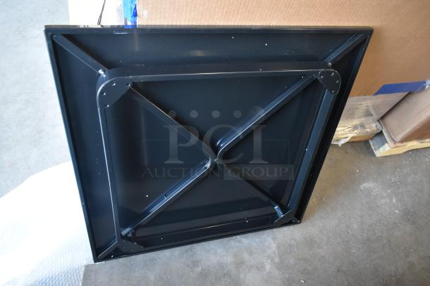 Black metal table base with X-brace design. New scratch and dent condition. Part of a lot of 18 various items.