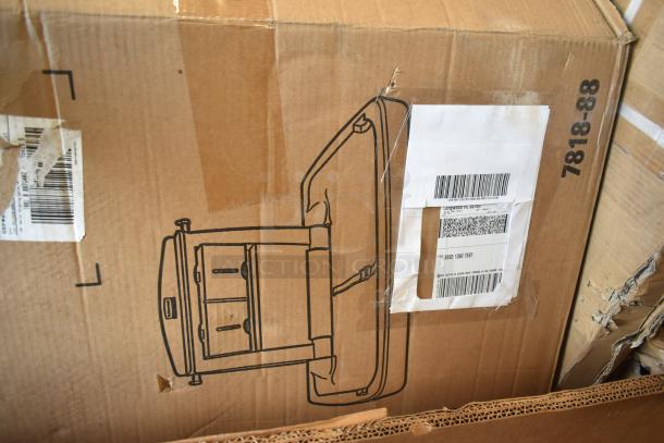 Cardboard box labeled with shipping barcode and a line drawing of a kitchen pan rack. Box in new but dented condition.