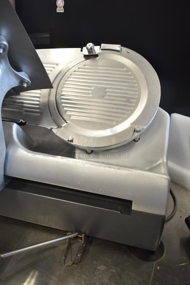 Hobart 2912 commercial semi-automatic meat slicer, 115 volts, 1 phase. Stainless steel finish, well-maintained condition.