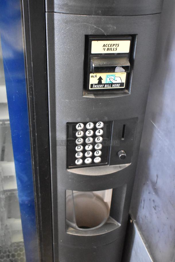 Crane 5800-4 vending machine, accepts $1 bills, keypad, metal design, 115 volts, 1 phase, commercial use.
