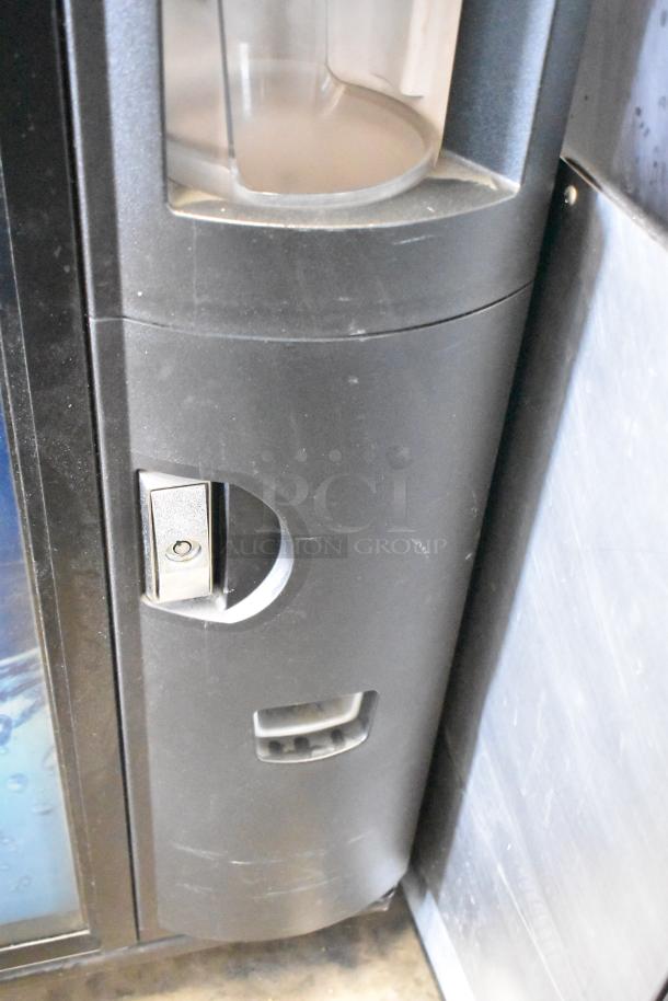 Crane 5800-4 Commercial Drink Vending Machine, metal, with bill acceptor, 115V, 1 Phase; shows lock and coin slot detail.