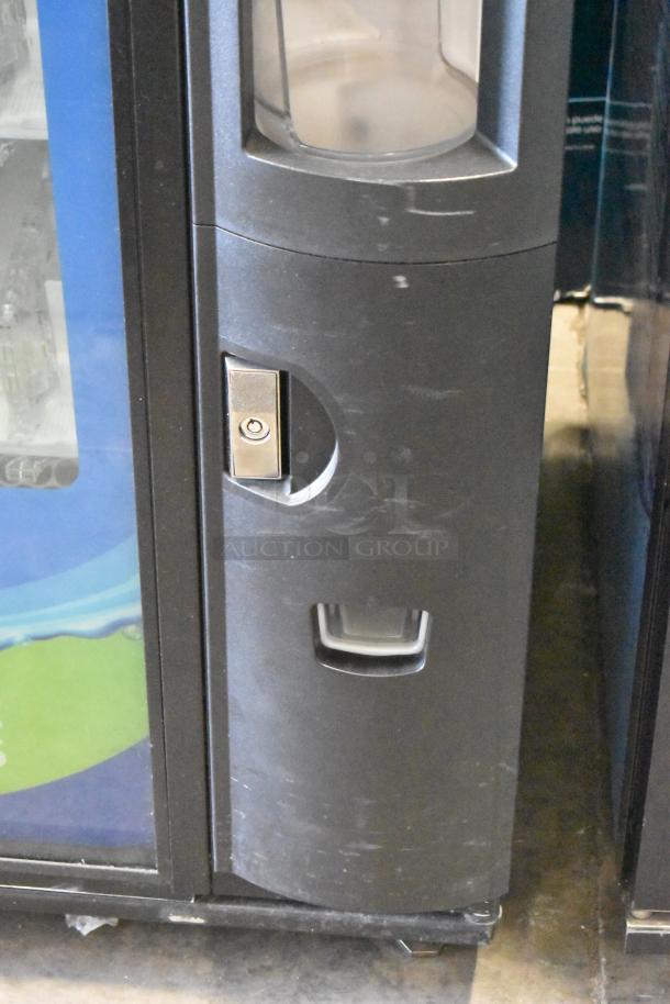 Crane 5800-4 metal vending machine with bill acceptor, 115 volts, 1 phase. Scratches visible, commercial model.