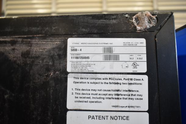 Crane 5800-4 Metal Vending Machine, 115V, 1 Phase, with bill acceptor. Worn label displaying model and serial number.