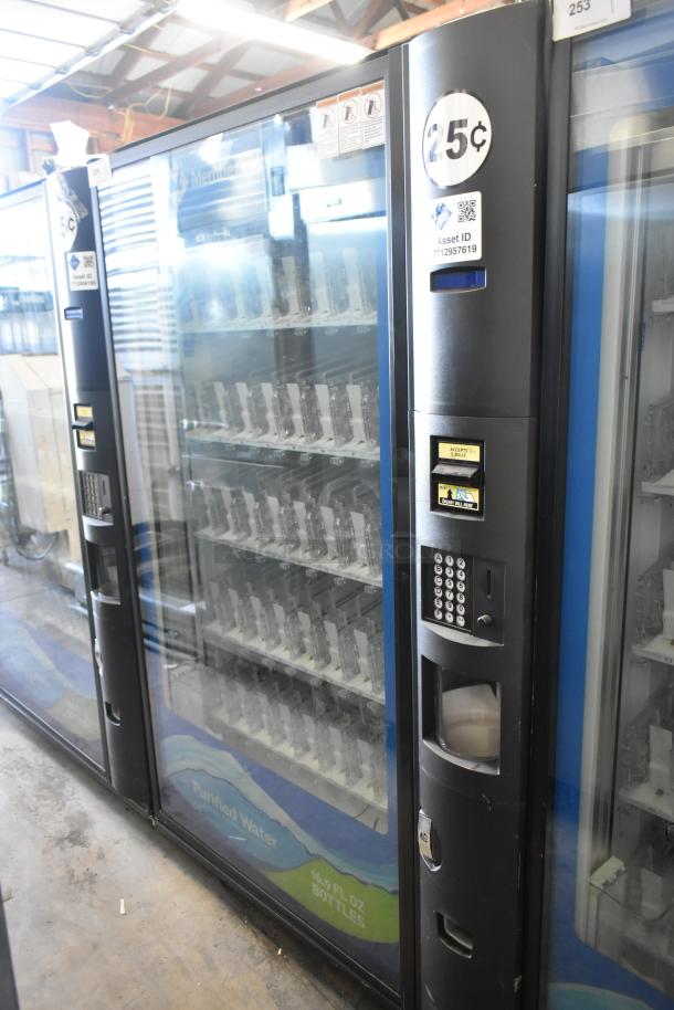 Crane 5800-4 metal drink vending machine with bill acceptor, 115 Volts, 1 Phase, showing price label and control panel.