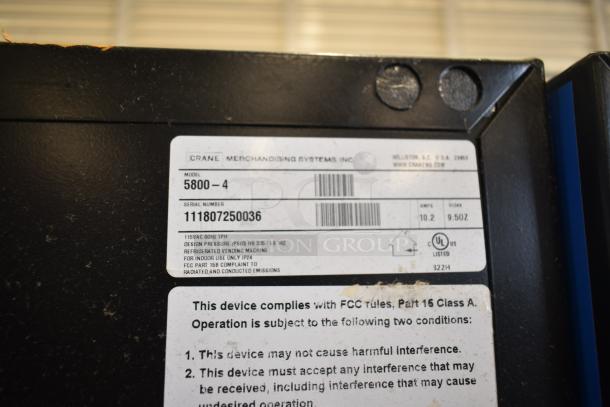 Crane 5800-4 metal commercial drink vending machine, 115V, 1 Phase, with bill acceptor. Label shows model, serial number.