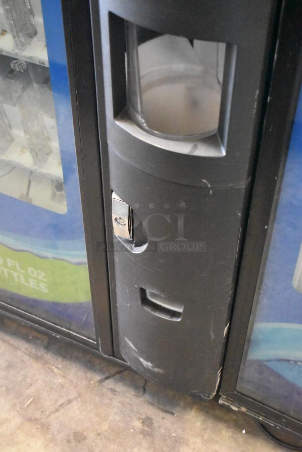 Crane 5800-4 vending machine with bill acceptor, showing coin slot and bottle display. 115V, 1 phase. Used condition.