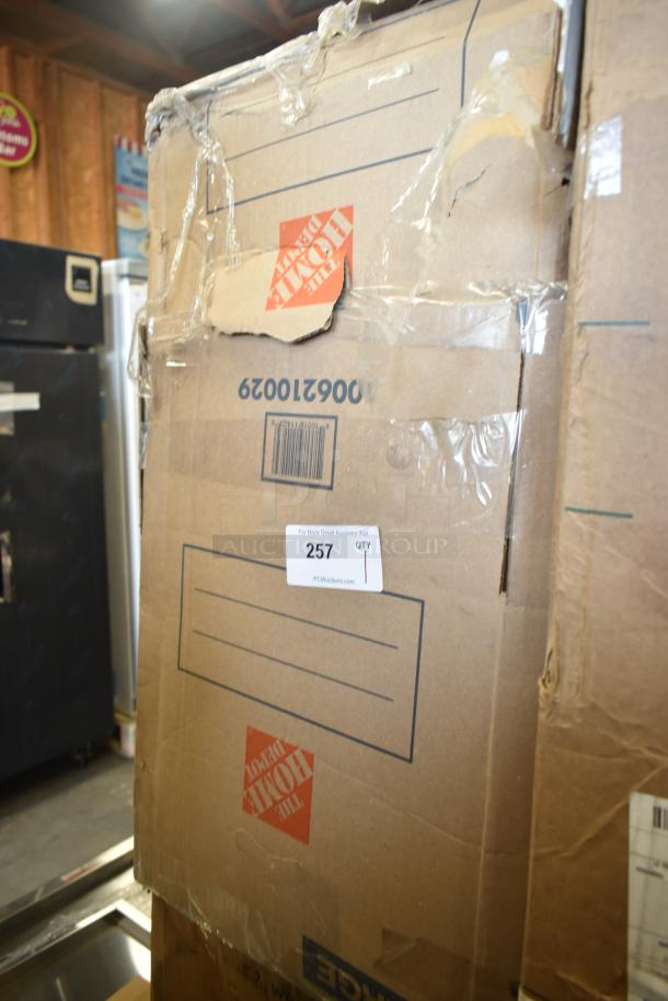 Box containing a Honeywell 18" dishwasher, labeled "scratch and dent." Visible shipping label and auction sticker, item 257.
