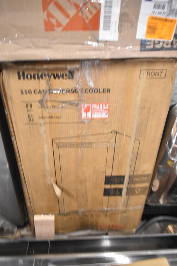 Brand new Honeywell H115BCS 115-can cooler in box. Scratch and dent condition, 115 volts, 1 phase, fragile sticker visible.
