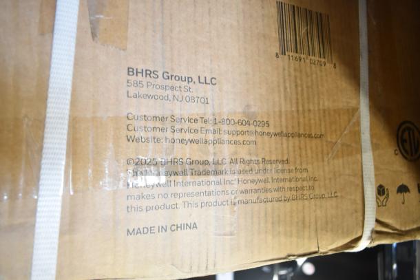 Cardboard box for Honeywell H115BCS Cooler, showing manufacturer details and customer service information. Made in China.