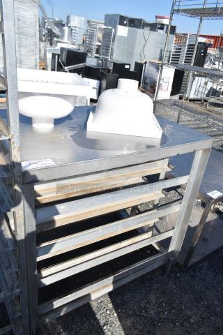 Commercial pan rack with contents shown outdoors. Metal construction with visible wear. Label indicates lot number 206.