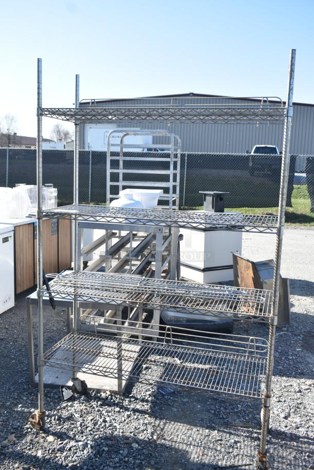 Chrome finish 4-tier wire shelving unit in used condition. Buyer must dismantle; consider freight costs.