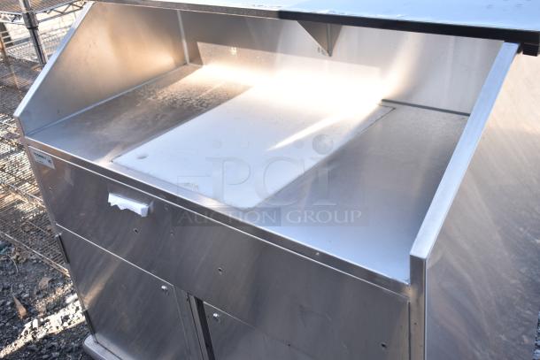 BRAND NEW Regency 48" stainless steel portable bar with removable speed rails and ice bin. Scratch and dent condition.