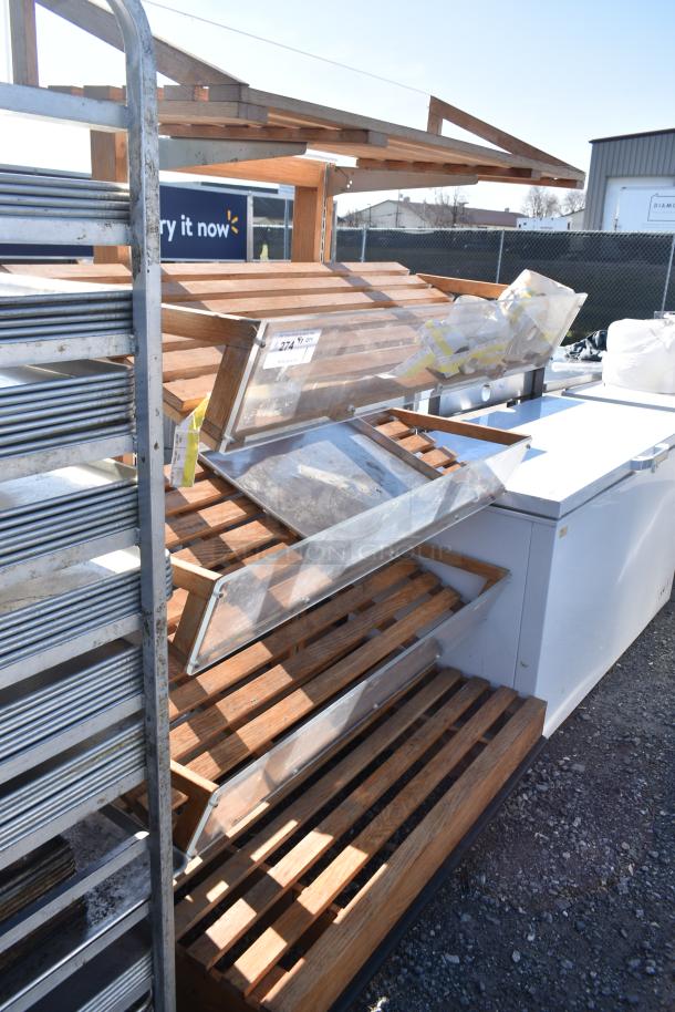 Wooden produce merchandising shelf with slatted design and clear display bins. Shows moderate wear. Tag indicates item 274.