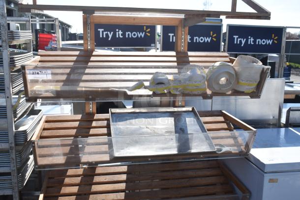 Wooden Produce Merchandising Shelf with multiple tiers, clear front panels, and integrated label rolls. Used condition.