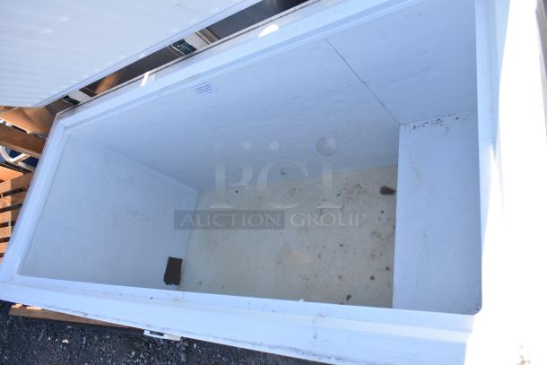 Titan XTCF16 chest freezer, 115V, 1 phase, white interior, visible wear, spacious storage for efficient cooling.