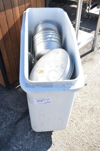 White poly ingredient bin on commercial casters, contains round cake pans, visible label with item number 278.