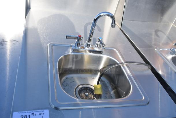 QualServ WMSC24MS portable sink with chrome faucet, stainless steel finish, on commercial casters, light wear visible.