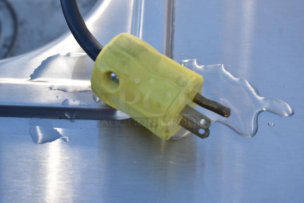 QualServ WMSC24MS portable sink with commercial casters, stainless steel surface, visible yellow power plug.