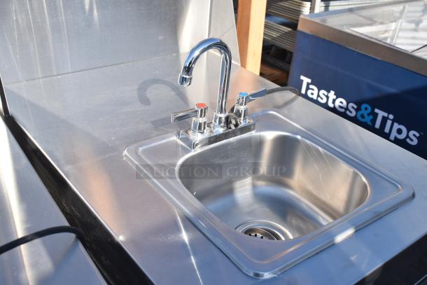 QualServ WMSC24MS commercial portable sink with casters. Stainless steel finish, dual faucets, excellent condition.