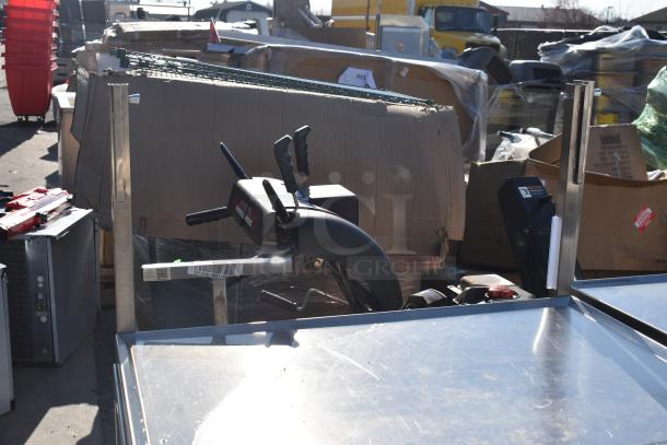 Commercial portable counter by National Cart with under shelf, drawer, and casters. Includes barcode tag, visible in outdoor setting.