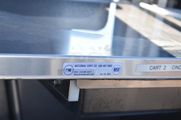 National Cart commercial portable counter with under shelf and drawer. Features commercial casters. NSF label visible.
