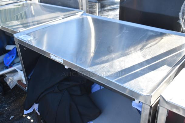 National Cart commercial portable counter with under shelf, drawer, and commercial casters. Stainless steel, good condition.