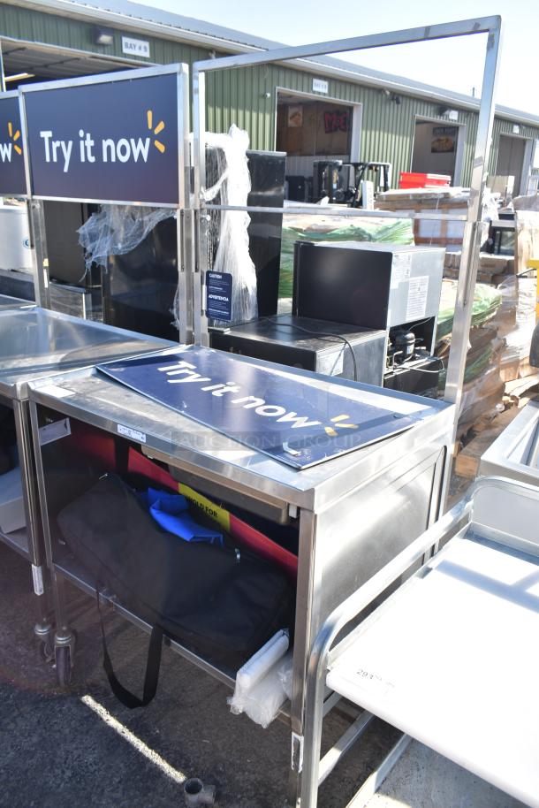 National Cart commercial portable counter with contents, under shelf, and drawer on commercial casters. "Try it now" sign included.