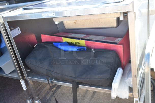National Cart commercial portable counter with contents, under shelf, drawer, and commercial casters; visible label reads "HOLD FOR."