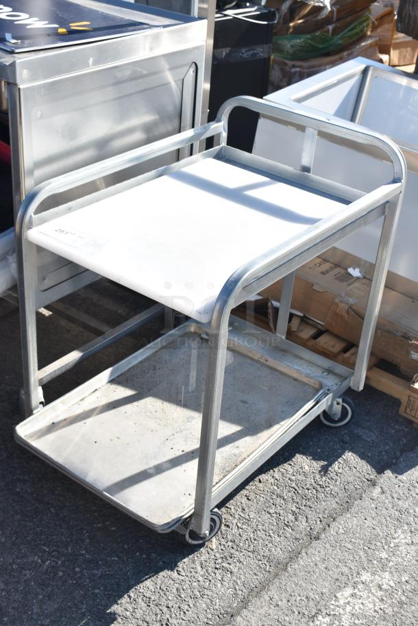 Commercial pan rack with two tiers, sturdy metal frame, and commercial casters for mobility. Used condition.