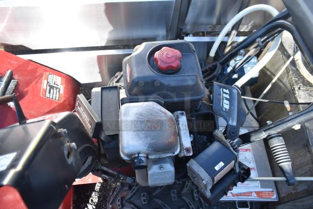 Craftsman 536.888110 30" snow thrower, visible engine parts, 11HP label, some surface rust on metal components.