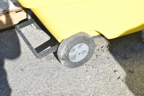 BRAND NEW Lavex Yellow Tilt Truck, showing durable wheel, minor scratches, excellent for transporting heavy items.
