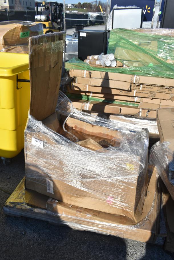 Pallet with shrink-wrapped cardboard boxes labeled "Skid Lot" indicating new, scratch and dent items for auction.