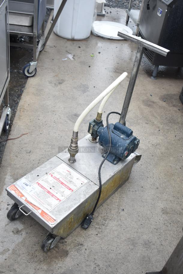 Frontline 401 Commercial Oil Caddy on casters, 115V, 1 phase. Metal body, pipes, and motor visible. Warning labels attached.