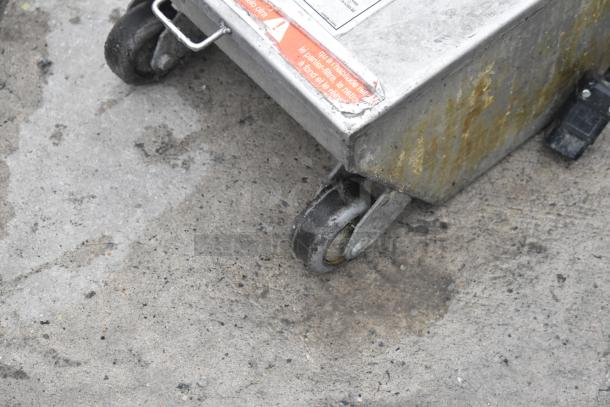 Frontline 401 Commercial Oil Caddy on casters, 115V, 1 phase; visible wear and caution label on side.