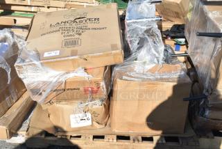 Cardboard boxes containing new scratch and dent items, including Lancaster 27.5"x27.5" outdoor table, on a pallet.