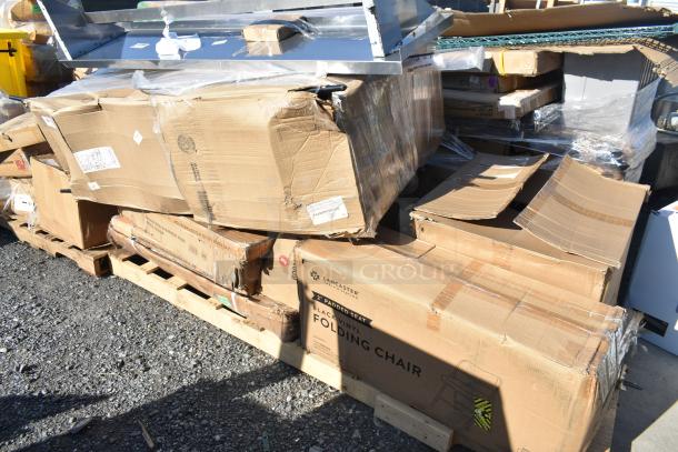 Damaged boxes of new Lancaster 2" padded seat black vinyl folding chairs on pallets; visible dents and tears.