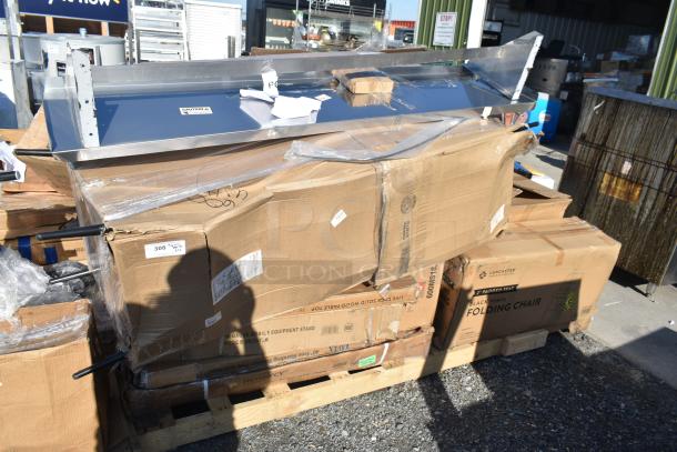 Cardboard boxes labeled "Black Vinyl Folding Chair" and equipment parts on a pallet, marked as scratch and dent items.