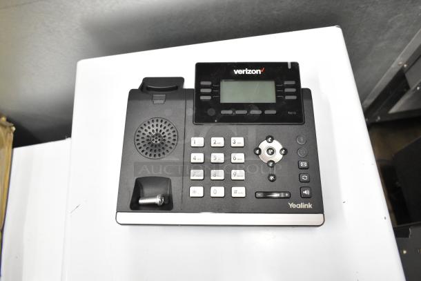 Yealink corded office telephone T41S with digital display and keypad, branded Verizon, in good condition.