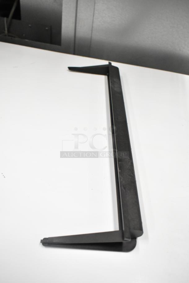 Black metal bracket, part of a six-item scratch and dent auction set, pristine condition, includes condenser drain pan and more.