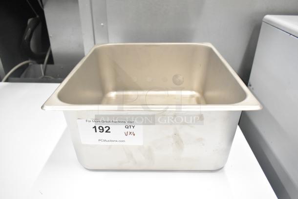 Stainless steel condenser drain pan with minor scratches, labeled with auction lot number 192, perfect for HVAC systems.