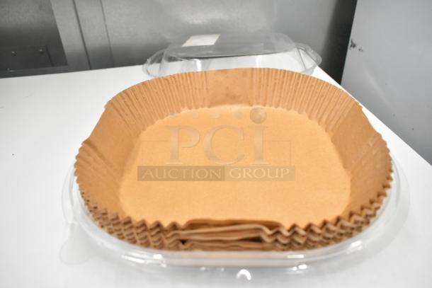 X004X0DMFT Air Fryer Liners, stack of brown, round, pleated paper liners in good condition, shown in clear packaging.
