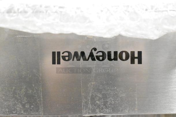 Brand new Honeywell dishwasher, stainless steel, some scratches, visible Honeywell logo. Scratch and dent condition.