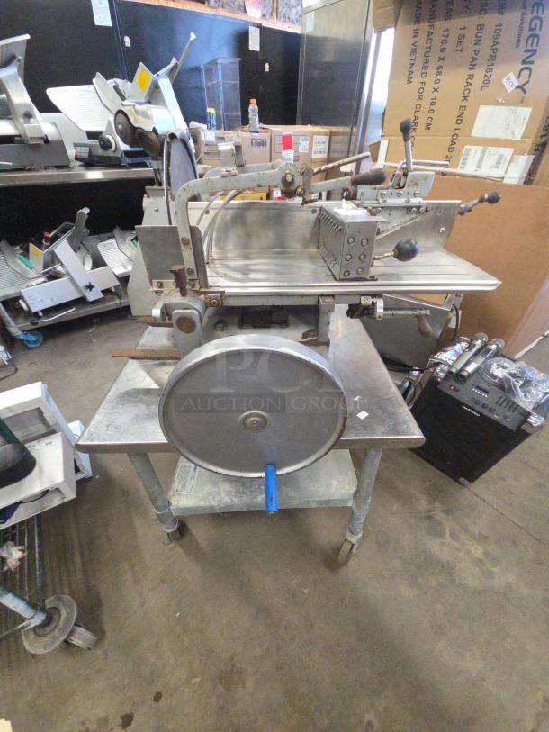US Berkel commercial countertop flywheel meat slicer on stand, missing power cord, condition uncertain due to inability to test.
