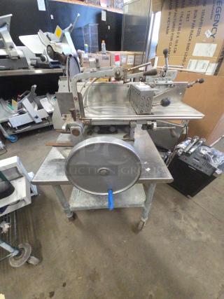 US Berkel commercial countertop flywheel meat slicer on stand, missing power cord, condition uncertain due to inability to test.