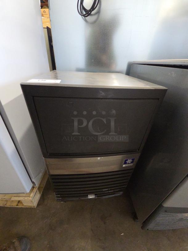 Manitowoc QM45A undercounter ice maker, 95 lbs/day capacity, black finish, 115 Volts, used condition.